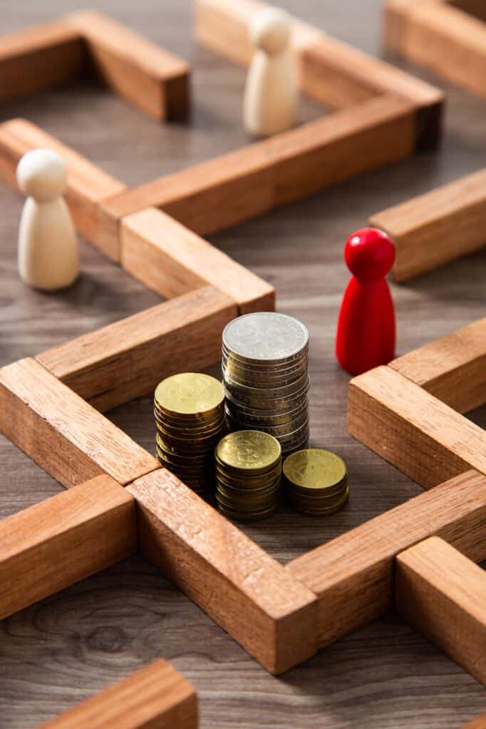 #01 - Casemeeting 3 Group of coins heaps in the maze game built by wood blocks, find a way to money resource concept